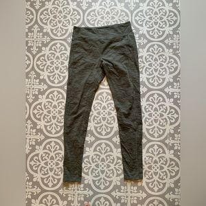 Olive green, athletic pants with back zipper pocket